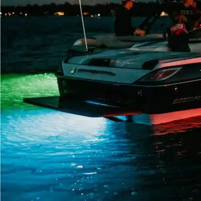 Boat in Slip with Tidal Wake underwater LED light shinging at night